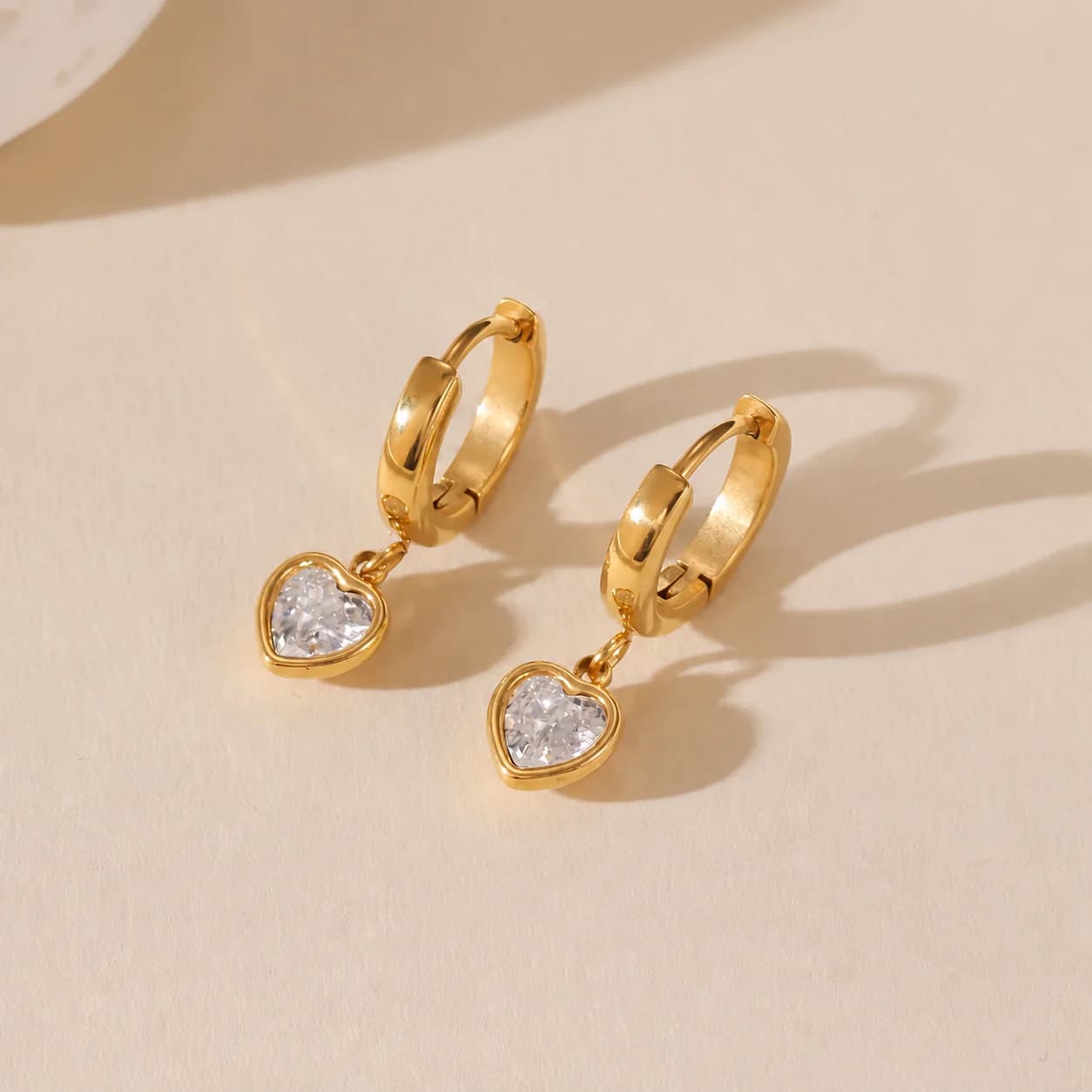 Women's Eros Heart Charm Huggie Hoops In Gold Tone